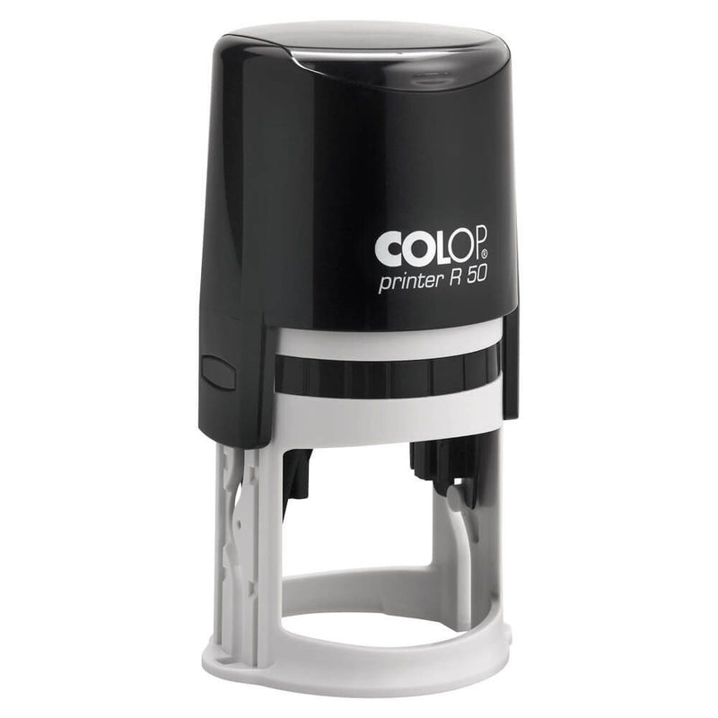 Colop firmas apaļš automātiskais zīmogs R50 melnā korpusā ar baltiem logo burtiem. 